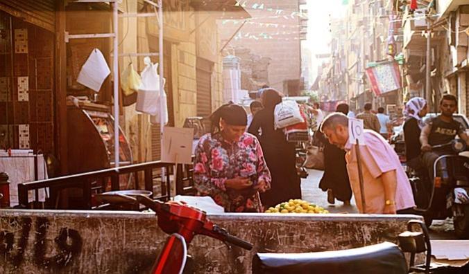 Friendly bargaining at a street market in Cairo