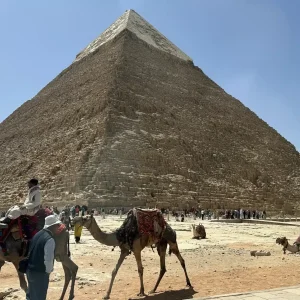 Great Pyramid of Giza with camels and tourists in foreground, Egypt