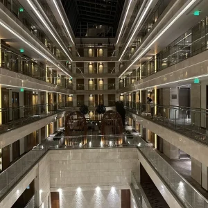 Modern hotel atrium lobby with glass railings at Holiday Inn Jaipur City Centre, India