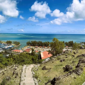 Aerial view of Port Mathurin town with colorful roofs and coastal harbor in Rodrigues Island