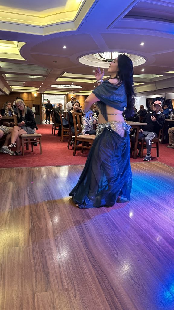 Belly dancer performing for guests on a Nile dinner cruise in Cairo on Day 9 of a 10-Day Egypt Itinerary.