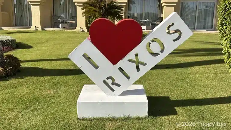 I love rixos garden sign at rixos sharm el sheikh, with lawns and resort rooms behind